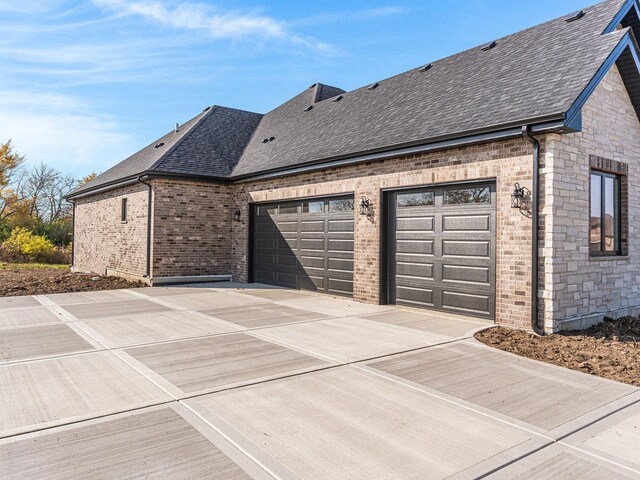 view of side of home with a garage