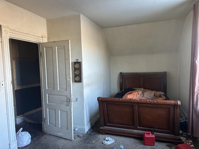 bedroom featuring vaulted ceiling