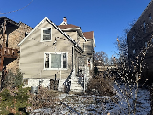 view of snow covered house