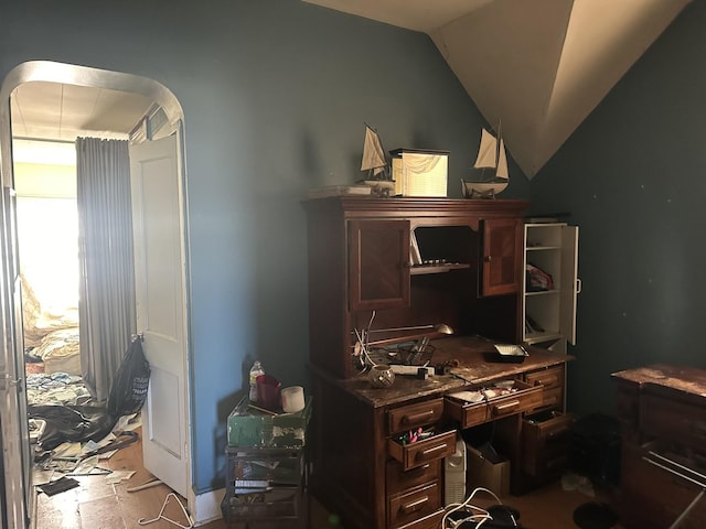 home office featuring vaulted ceiling