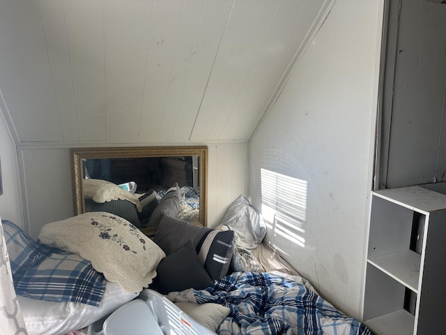 bedroom with wood walls