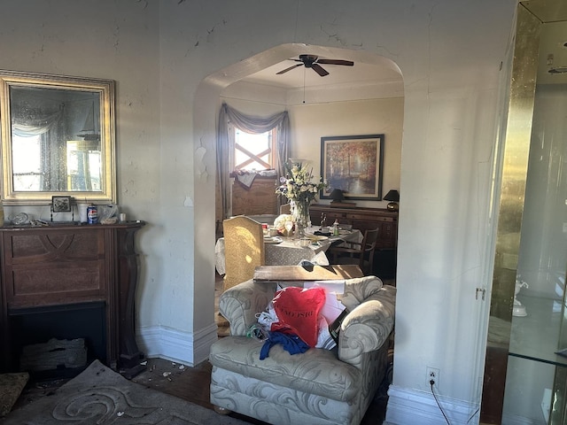 sitting room featuring ceiling fan