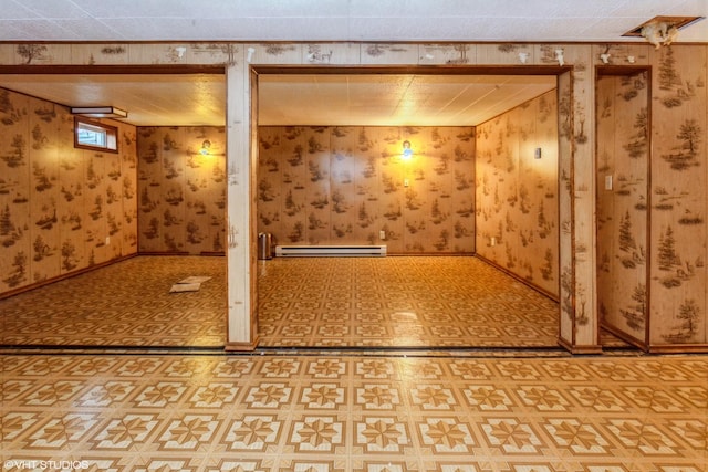 basement featuring a baseboard heating unit