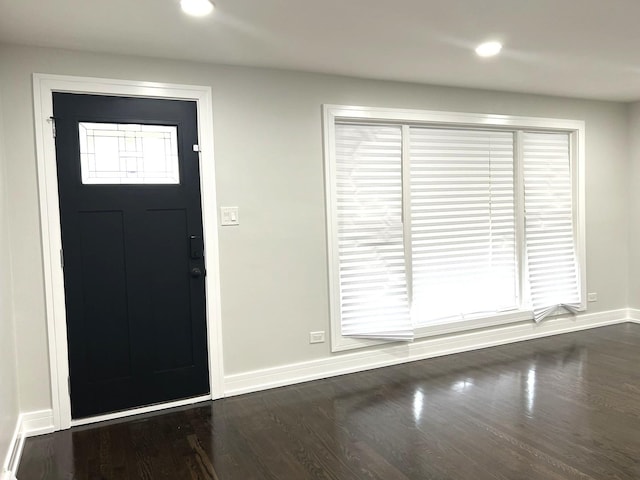 foyer with baseboards, dark wood-style flooring, and recessed lighting