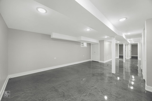 finished below grade area featuring recessed lighting and baseboards