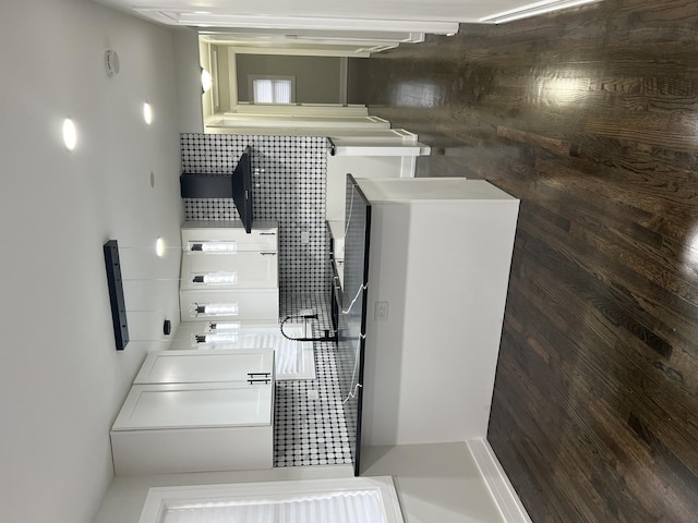 kitchen with decorative backsplash and white cabinetry