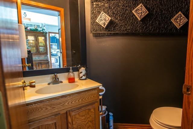 bathroom featuring vanity and toilet