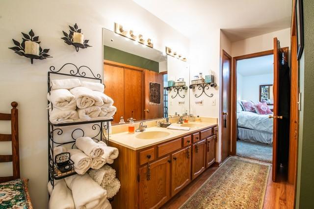 bathroom featuring vanity and hardwood / wood-style flooring