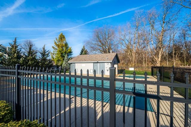 view of swimming pool with a patio area and an outdoor structure