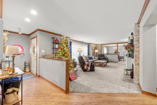 living room featuring light hardwood / wood-style flooring and crown molding