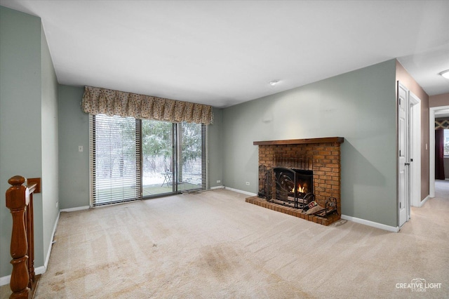 unfurnished living room with light carpet and a brick fireplace