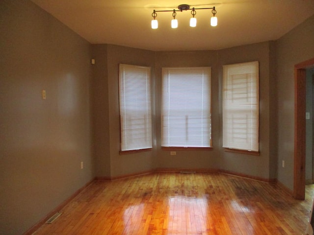 spare room featuring hardwood / wood-style floors