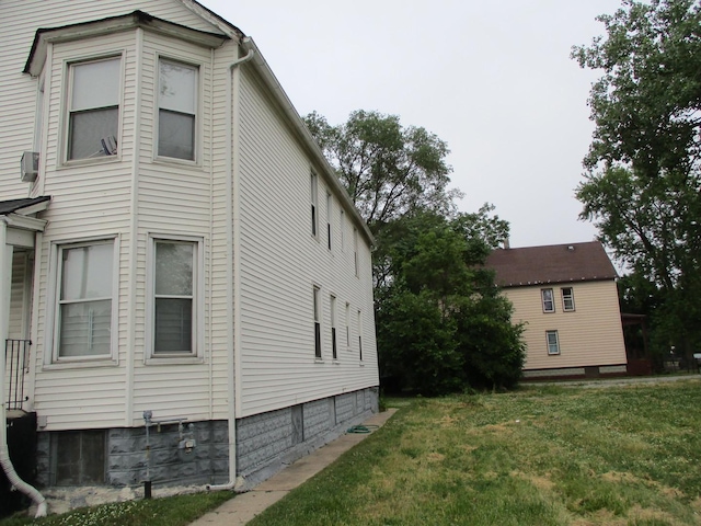 view of property exterior featuring a lawn