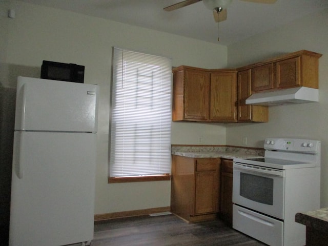 kitchen featuring ceiling fan, dark wood-type flooring, and white appliances