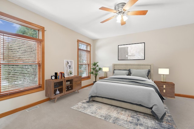 carpeted bedroom with ceiling fan