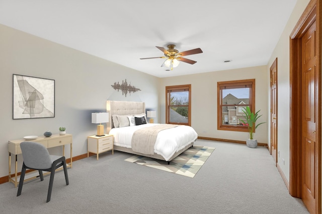 carpeted bedroom featuring ceiling fan