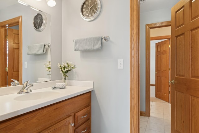 bathroom featuring tile patterned flooring and vanity