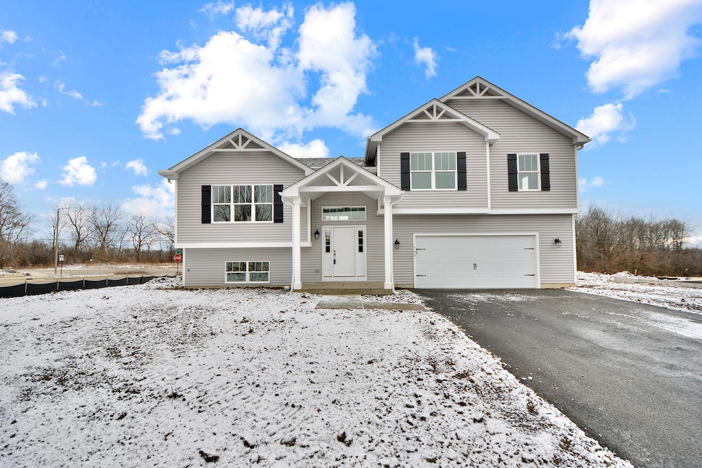 split foyer home featuring a garage