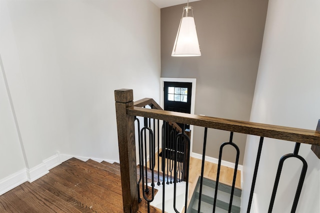 staircase featuring hardwood / wood-style flooring