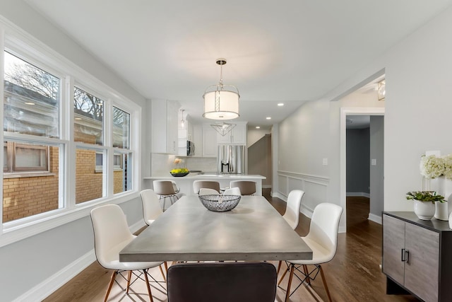 dining space featuring dark hardwood / wood-style flooring