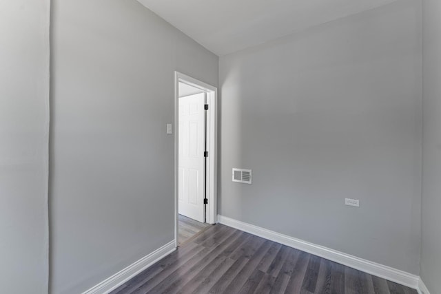 unfurnished room featuring dark hardwood / wood-style floors