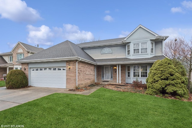 view of property featuring a garage and a front lawn