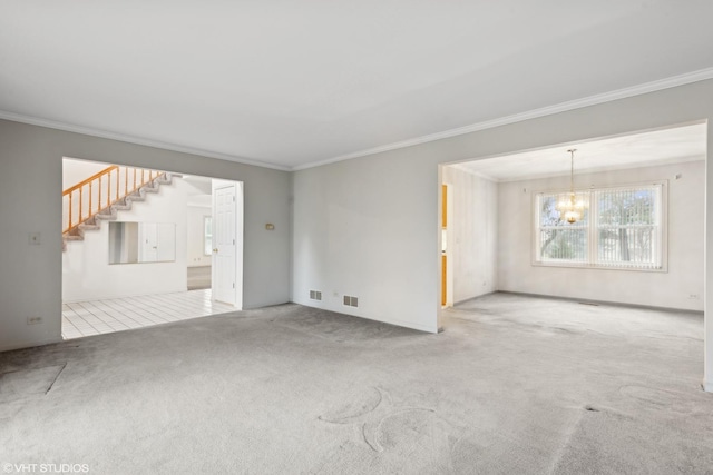 unfurnished living room with crown molding, light colored carpet, and a notable chandelier