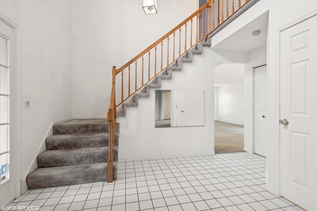 stairway featuring tile patterned floors