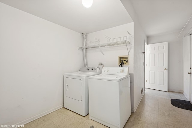 clothes washing area featuring independent washer and dryer