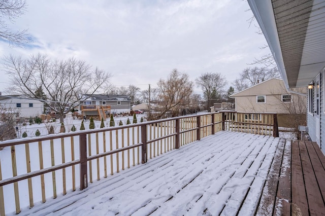 view of snow covered deck