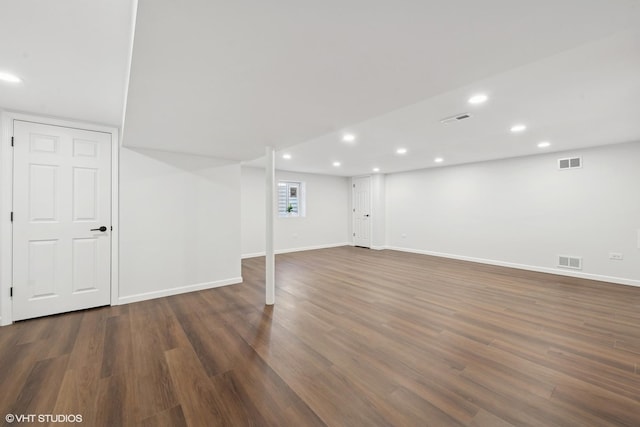 basement with dark wood-type flooring