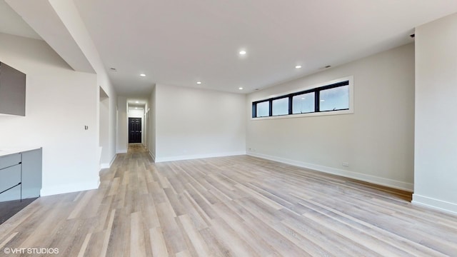 unfurnished living room with light wood-type flooring