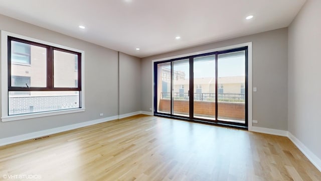 unfurnished room featuring light wood-type flooring