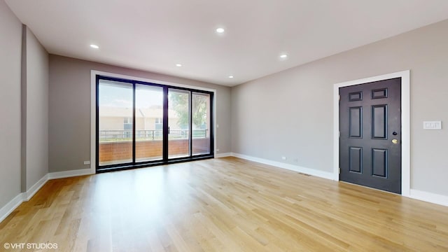 empty room with light hardwood / wood-style floors