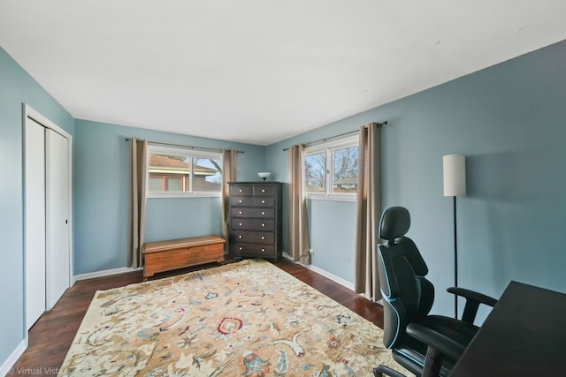 home office featuring plenty of natural light and dark wood-type flooring