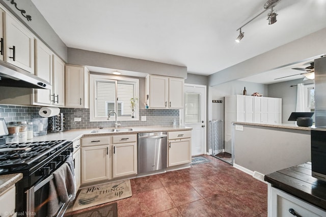 kitchen with ceiling fan, stainless steel appliances, tasteful backsplash, and sink