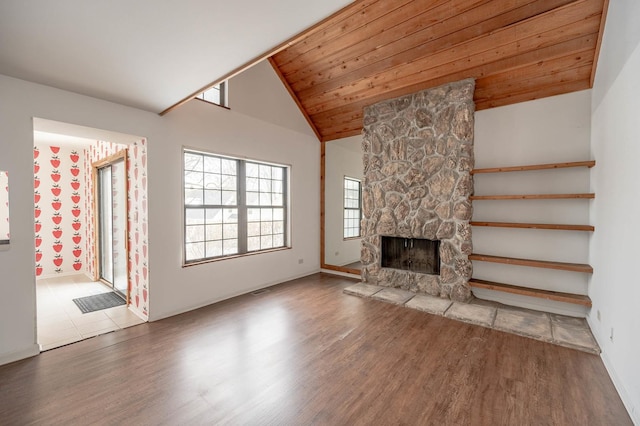 unfurnished living room featuring a fireplace, wooden ceiling, lofted ceiling, and wood-type flooring