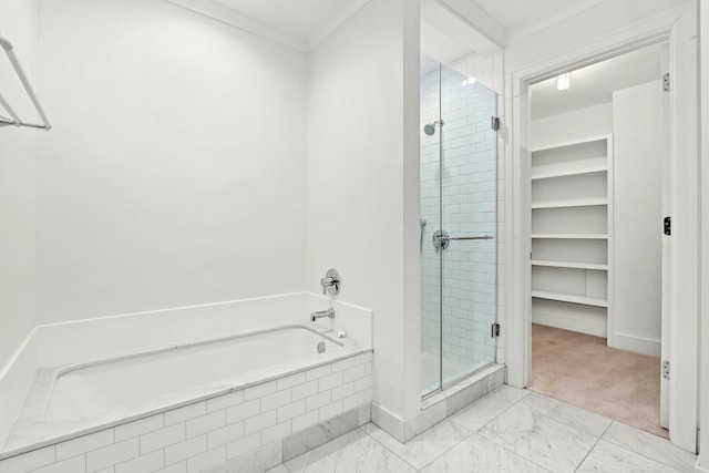 bathroom with crown molding and separate shower and tub