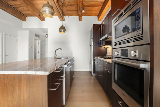 kitchen with wooden ceiling, appliances with stainless steel finishes, and beamed ceiling