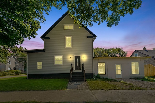 front facade featuring a yard