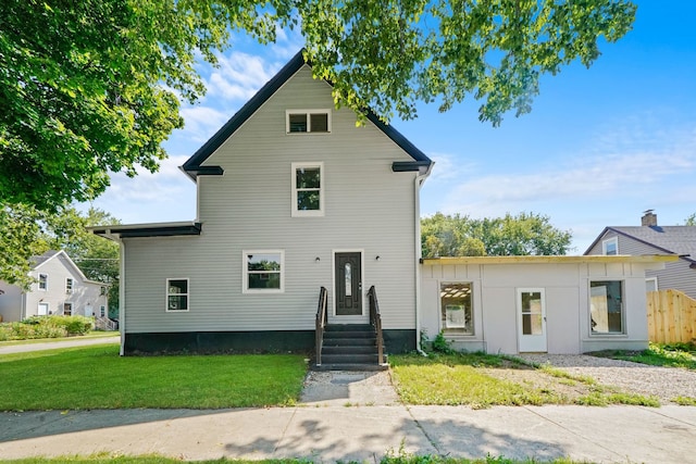 view of front property with a front lawn