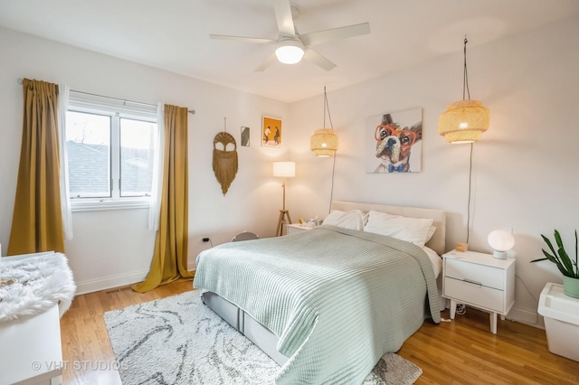 bedroom featuring ceiling fan and light hardwood / wood-style flooring