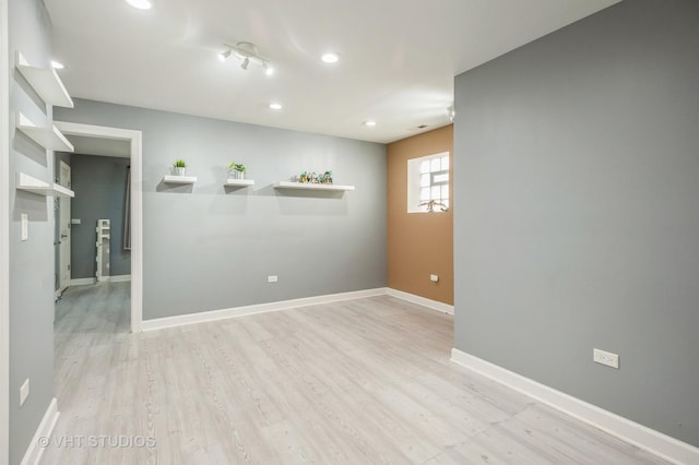 spare room featuring light hardwood / wood-style floors