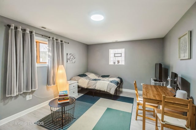 bedroom with hardwood / wood-style floors