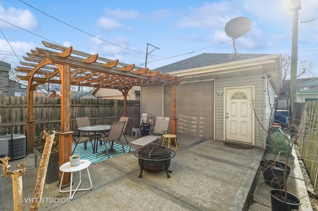 view of patio / terrace featuring a pergola, a fire pit, and central air condition unit