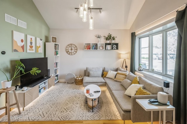 living room featuring lofted ceiling