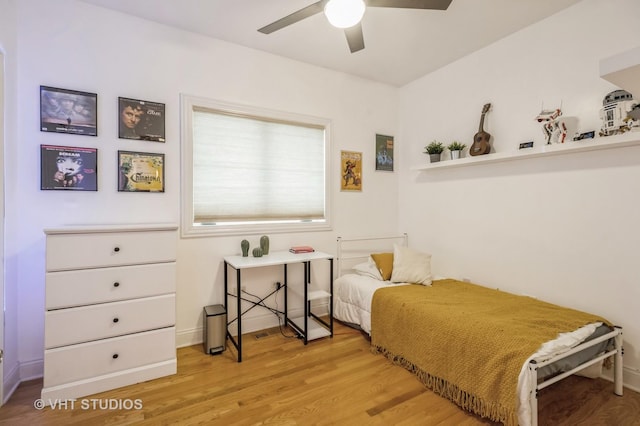 bedroom featuring hardwood / wood-style floors and ceiling fan