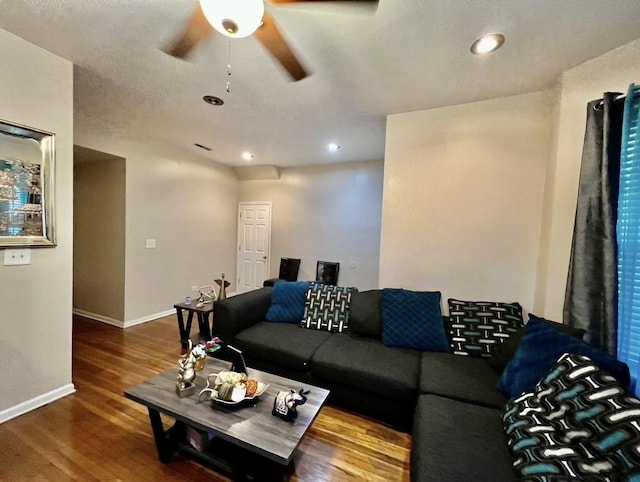 living room with a textured ceiling and hardwood / wood-style flooring