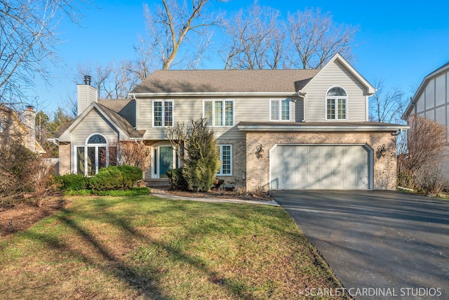 front of property featuring a garage and a front yard