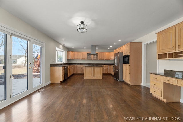 kitchen with sink, dark wood-type flooring, appliances with stainless steel finishes, island range hood, and built in desk